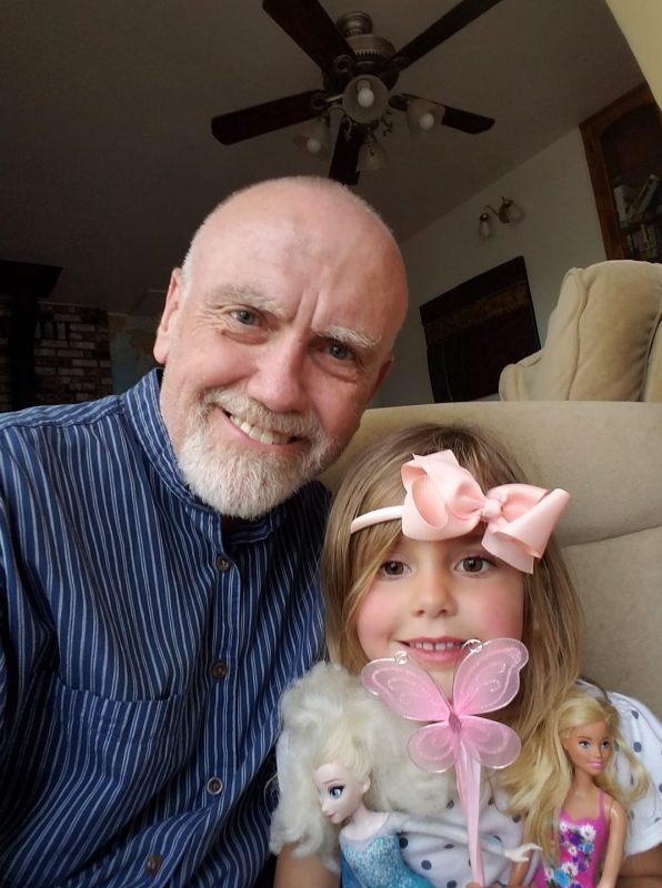 Photo of author Michael Newcomb with his Granddaughter.