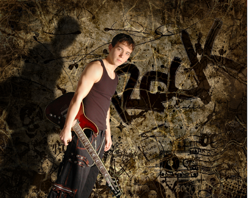 senior portrait of a boy with his guitar